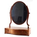 Property of a lady - a George III mahogany & boxwood strung oval swing-frame toilet mirror, with