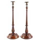 Property of a deceased estate - a large pair of 19th century mahogany candlesticks with cast brass
