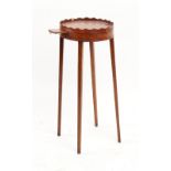 Property of a deceased estate - a George III mahogany oval topped urn stand, with shaped gallery &