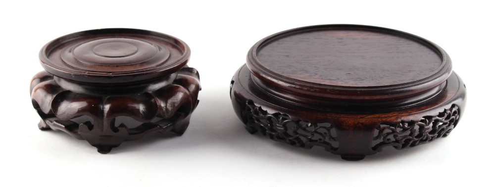 Property of a lady - two Chinese carved hardwood stands, early 20th century, one damaged, the larger