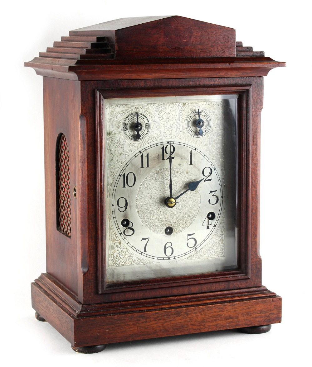 Property of a gentleman - an Edwardian mahogany mantel clock, with silvered dial, the German three-