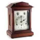 Property of a gentleman - an Edwardian mahogany mantel clock, with silvered dial, the German three-