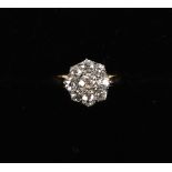 An 18ct yellow gold diamond cluster ring, the nine old European cut diamonds weighing a total of