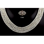 Property of a lady - a five row pearl necklace, the pearls approximately 4mm diameter, with