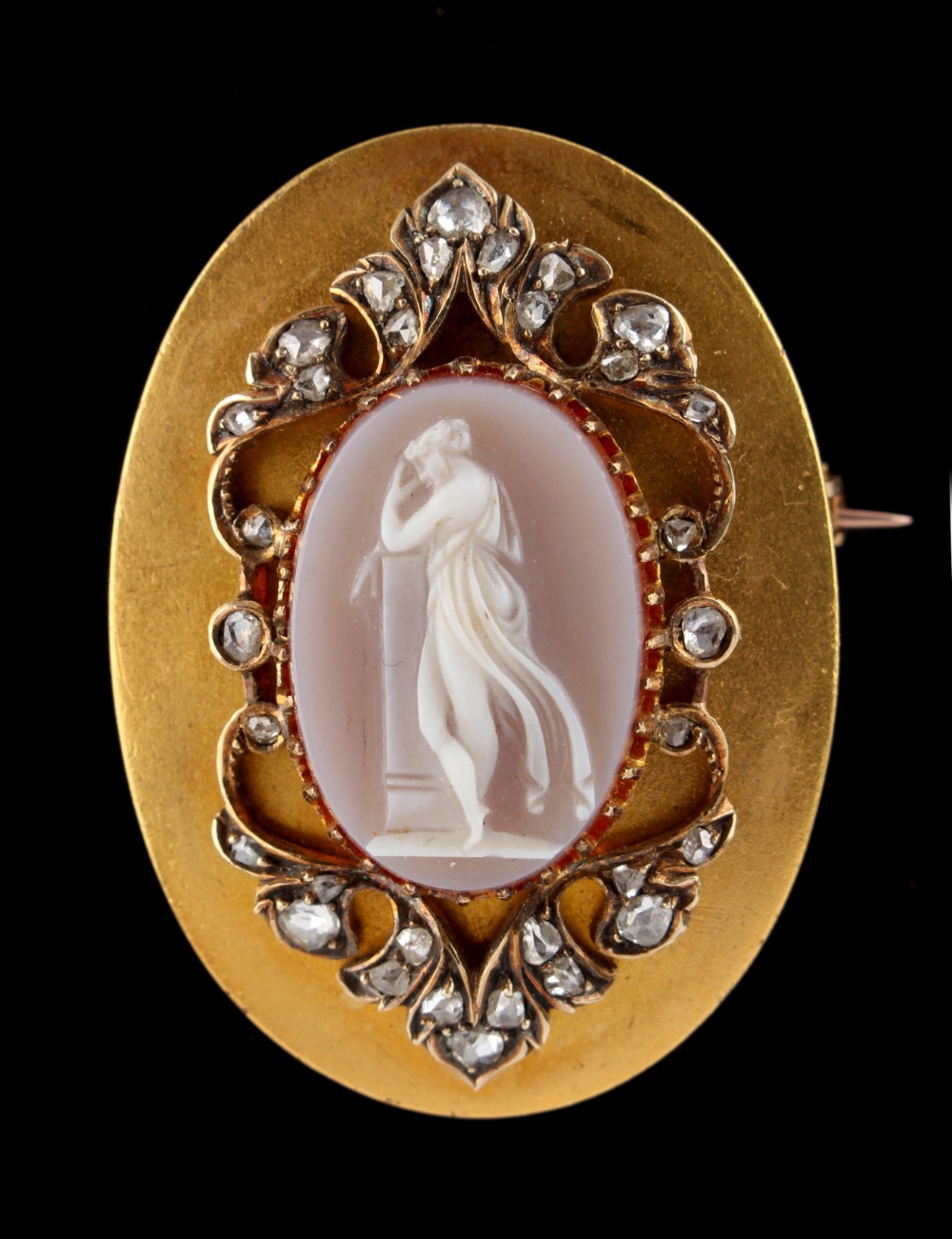 A 19th century Continental yellow gold oval mounted carved oval carnelian agate cameo pendant or