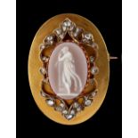 A 19th century Continental yellow gold oval mounted carved oval carnelian agate cameo pendant or