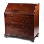 Property of a gentleman - an early 19th century George III mahogany fall-front bureau, with four