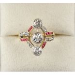 An early 20th century Continental yellow gold ruby & diamond ring, with a row of three Old