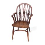 Property of a gentleman - an early 19th century yew wood Windsor elbow chair, of good colour,