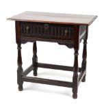 Property of a lady - a carved oak side table, parts 17th century, with nulled drawer & turned