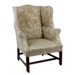 Property of a lady - a George III mahogany & damask upholstered wing armchair (see illustration).