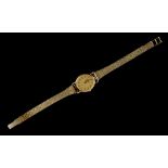 Property of a lady - a lady's Longines gold plated oval cased quartz wristwatch, on 9ct gold