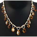 An oval cut citrine & seed pearl fringe necklace, 16.5ins. (42cms.) long (see illustration).