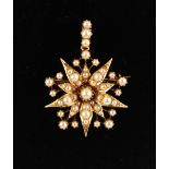 A late 19th / early 20th century yellow gold & seed pearl star brooch or pendant, 1.7ins. (4.