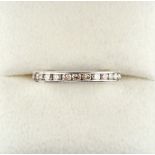 An 18ct white gold diamond eternity ring, size L (see illustration).