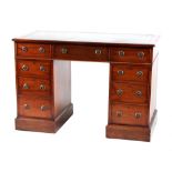 Property of a lady - a mahogany kneehole desk, early 20th century, with green leather inset top