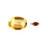 Property of a gentleman - a large loose oval cut citrine, approximately 24mm long; together with a