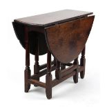 Property of a lady - a late 17th / early 18th century oak oval topped gate-leg table, 36.25ins. (