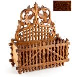 Property of a gentleman - a Bavarian Black Forest carved beechwood wall pocket or stationery rack,