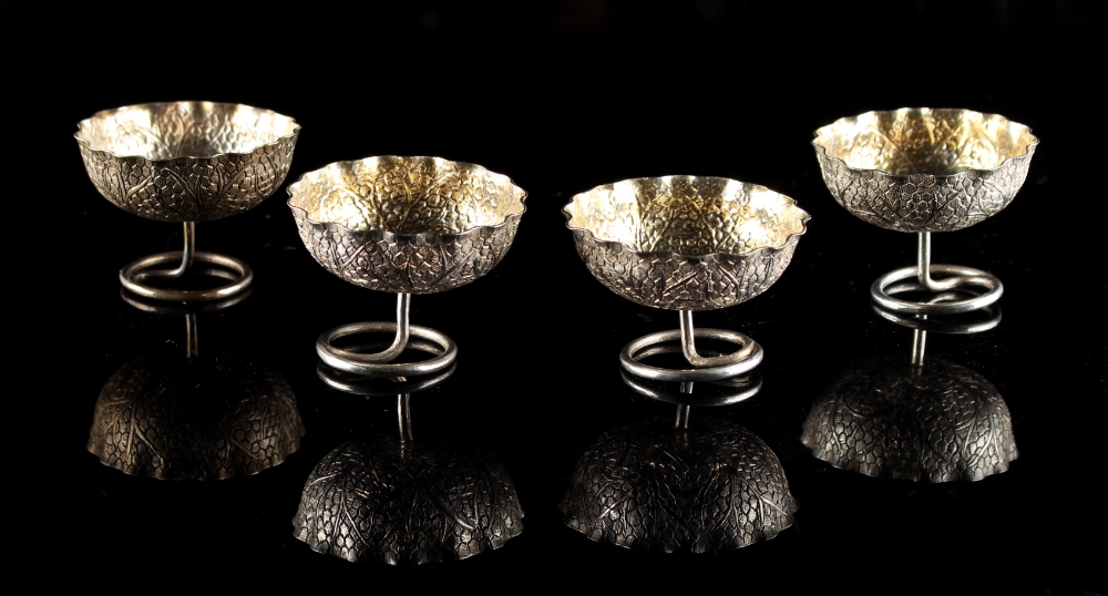 Property of a lady - a set of four unmarked white metal (test silver) salts modelled as leaves, each