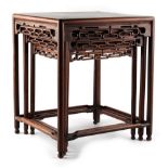 A nest of three Chinese hongmu stands or occasional tables, late 19th / early 20th century, with