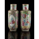 A pair of 19th century Chinese Canton famille rose vases, each 8.85ins. (22.5cms.) high (2) (see