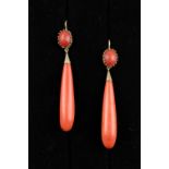 A pair of coral long pendant earrings, each 2.95ins. (7.5cms.) long (overall) (2) (see