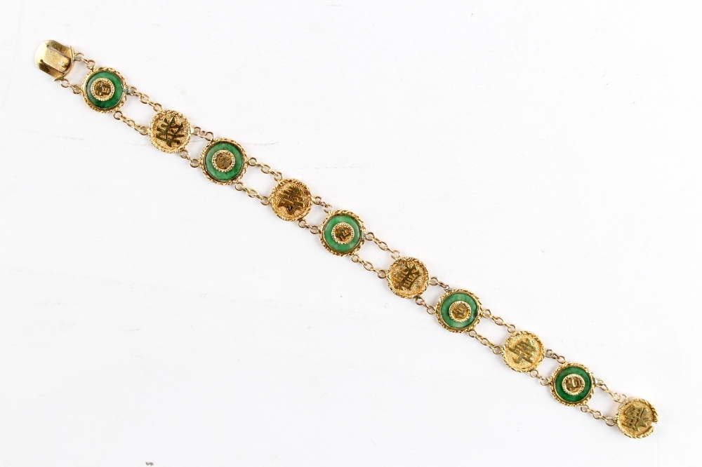 A Chinese 18ct yellow gold & jadeite circular panel bracelet, 7.6ins. (19.2ms.) long,