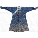 A Chinese silk dragon robe, early 20th century, with embroidered cream ground collar border (see