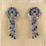 A very fine pair of 18ct white gold & platinum sapphire & diamond earrings, the navette cut