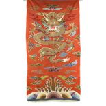 An early 20th century Chinese kesi brick red silk dragon panel, unframed,