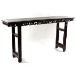 A 19th century Chinese hongmu altar table, approximately 83ins. (210cms.) long (see illustration).
