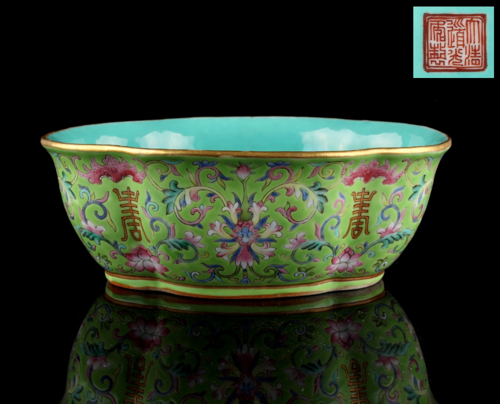 A good Chinese lime green ground elongated quatrefoil dish, painted with bats above calligraphy