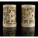 A small pair of 19th century Chinese Canton carved & pierced ivory brush pots, each (8.5cms.)