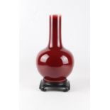 A Chinese sang de boeuf glazed bottle vase, 19th century, the base drilled for use as a table