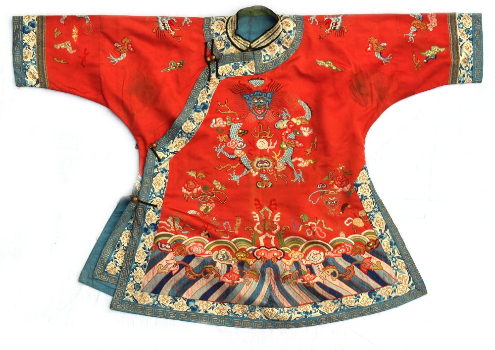 A Chinese embroidered red silk dragon jacket, late 19th / early 20th century, with lishui border (