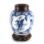 A Chinese blue & white ovoid jar, Kangxi period (1662-1722), with associated carved hongmu cover &