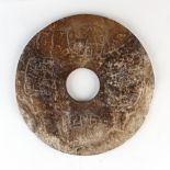 The Fryers Collection of Chinese Art - a large Chinese mottled brown jade bi disc, probably Song