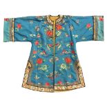 A Chinese embroidered mid blue silk lady's robe, early 20th century, with peonies, butterflies &