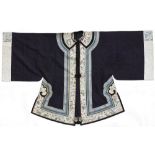 A Chinese embroidered silk lady's jacket, early 20th century, with brocade dragon roundels on a navy