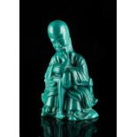 A Chinese blue Peking glass figure of a bearded scholar, early 20th century, 4.5ins. (11.4cms.) high