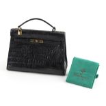 Property of a deceased estate - a Mulberry black crocodile handbag, in green cloth dust bag (see