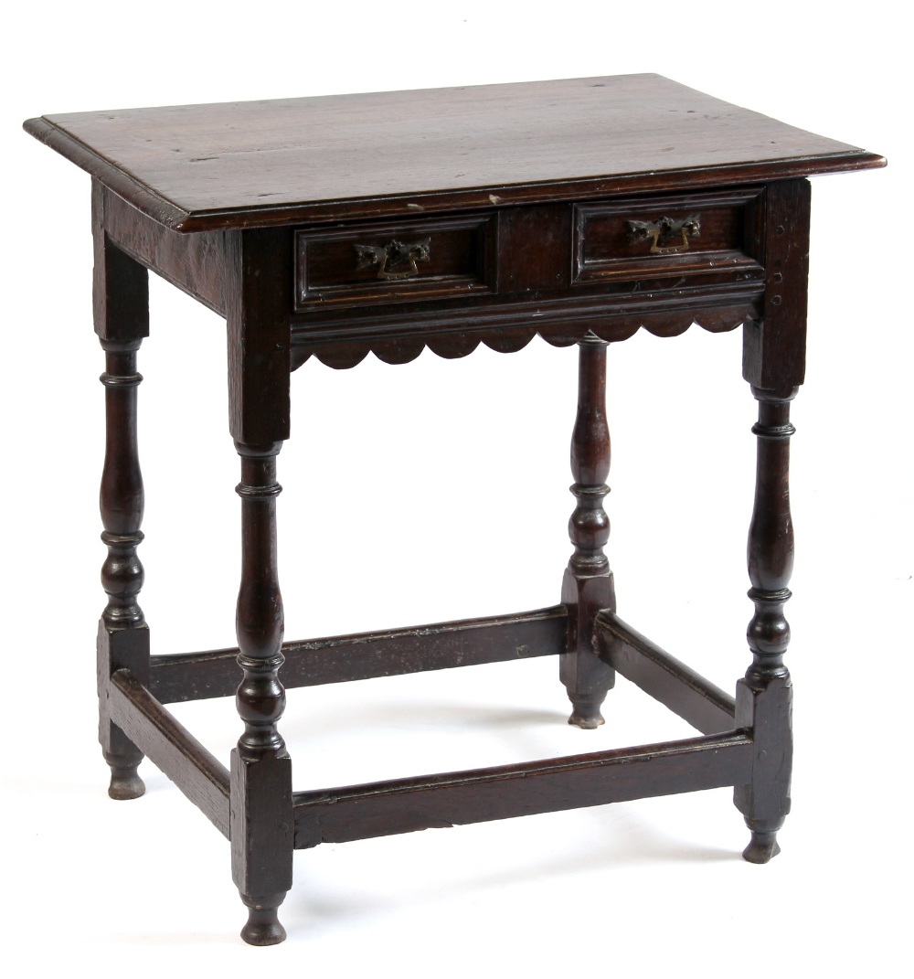Property of a lady - a small oak side table, with moulded frieze drawer & slender turned supports,