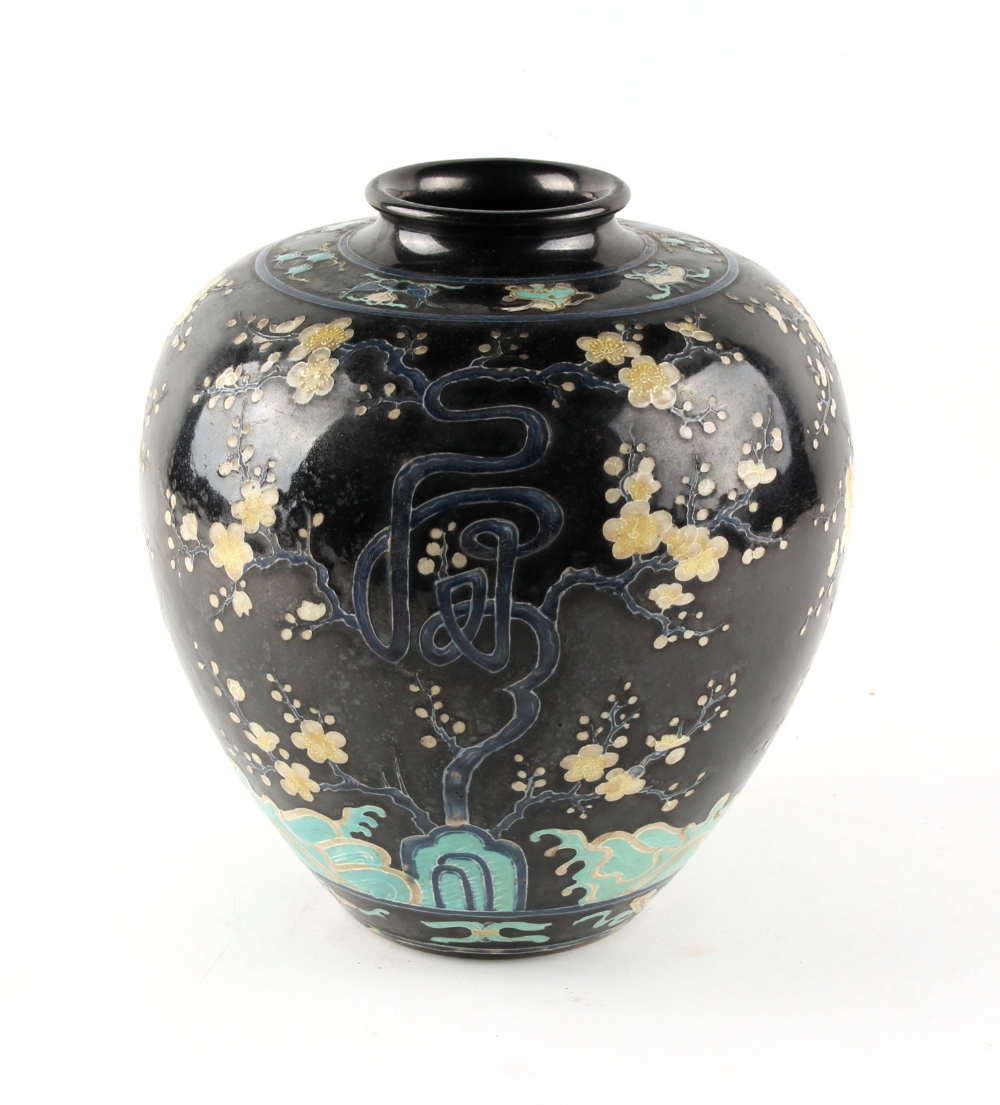 A Japanese black ground ovoid vase, late 19th / early 20th century, decorated with prunus above