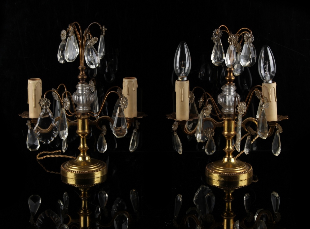 Property of a lady - a pair of ormolu & cut glass lustre twin light table lamps, each