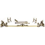 Property of a lady - a French Louis XV style gilt brass rocaille adjustable fender, the bar