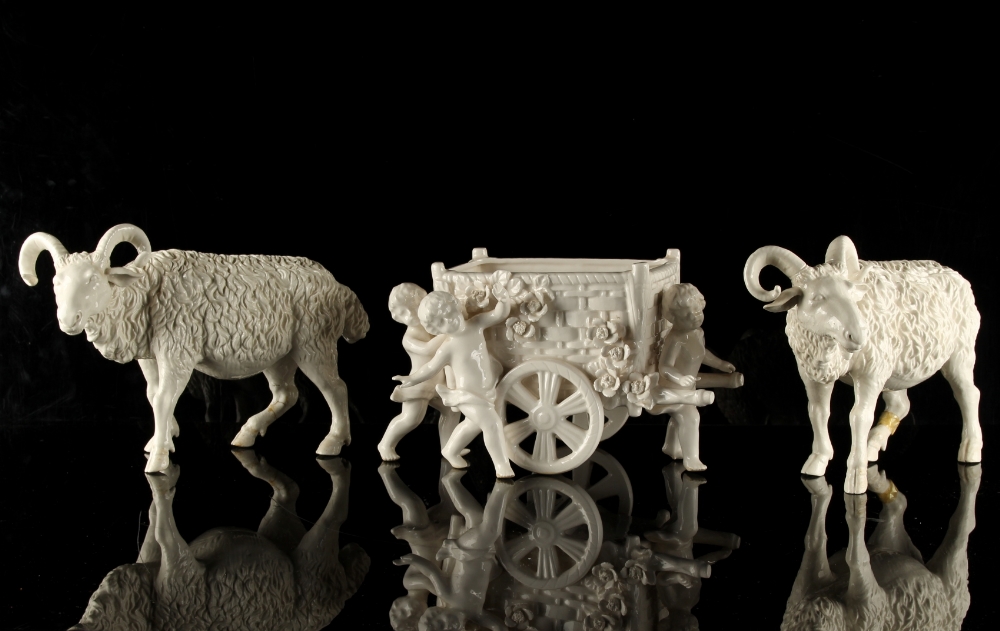 Property of a gentleman - a pair of plain white glazed porcelain models of standing goats,