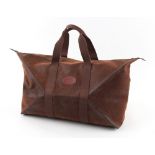 Property of a deceased estate - a Mulberry brown leather holdall (see illustration).