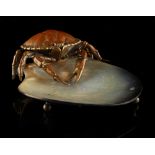 An abalone shell dish mounted with a bronze model of a crab, probably Japanese, 5.5ins. (14cms.)