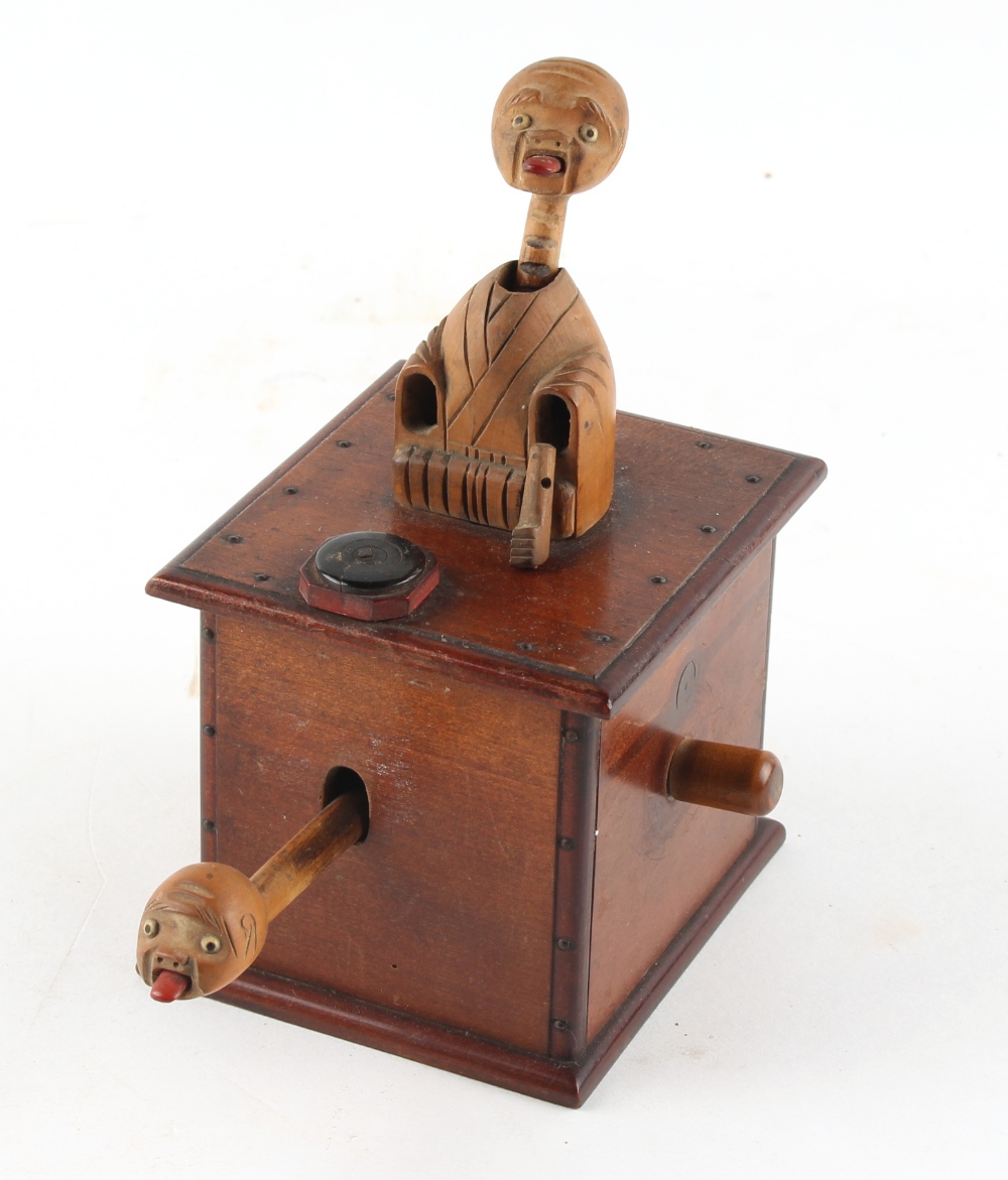 A Japanese wooden Kobe toy, one arm missing, 5.7ins. (14.5cms.) high (see illustration). - Image 2 of 2